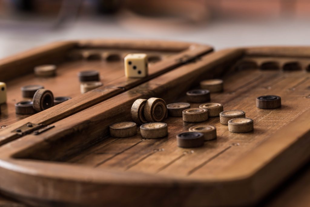 wooden Board with backgammon, pawns, dice, close up